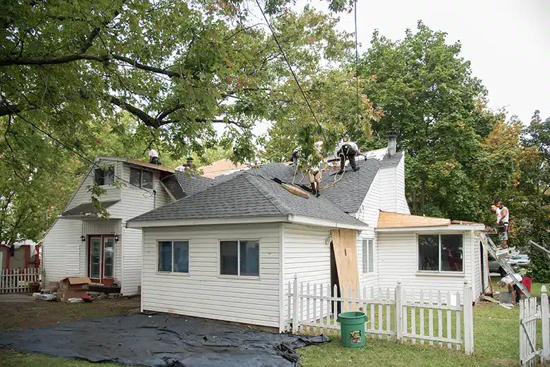 guys on the roof repairing