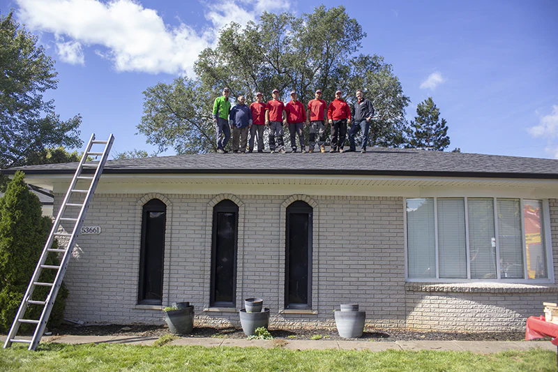 roofing contractors RoofingAboveAll on a roof